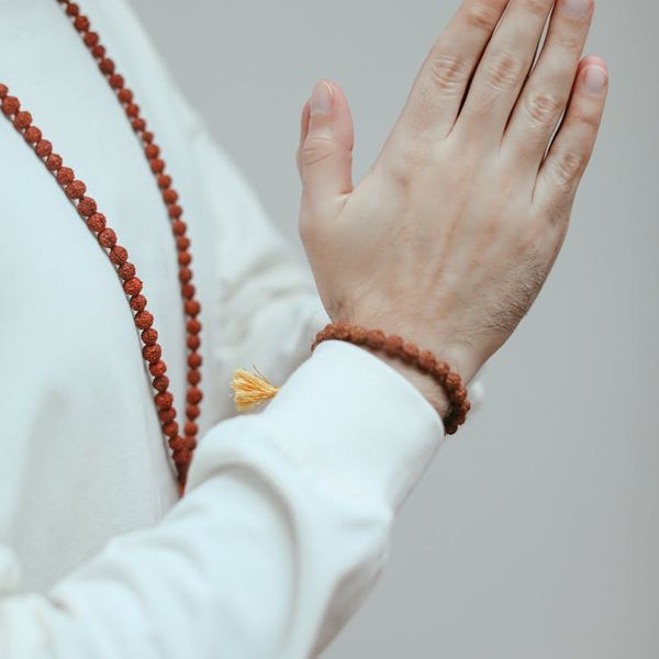 Close-up of hands in a meditative pose.